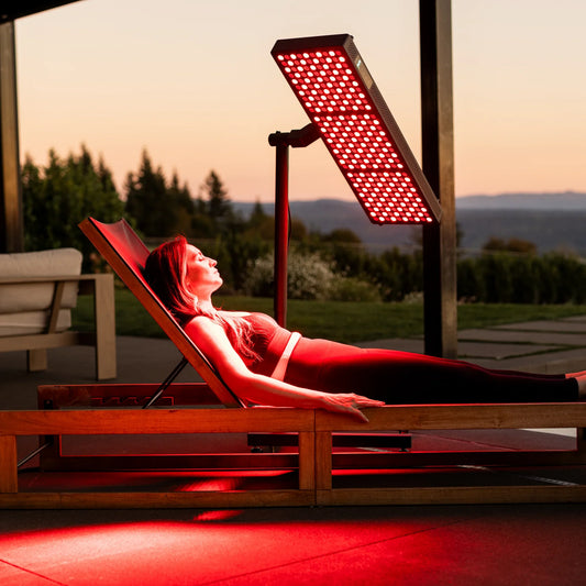 Woman receiving red light therapy outdoors